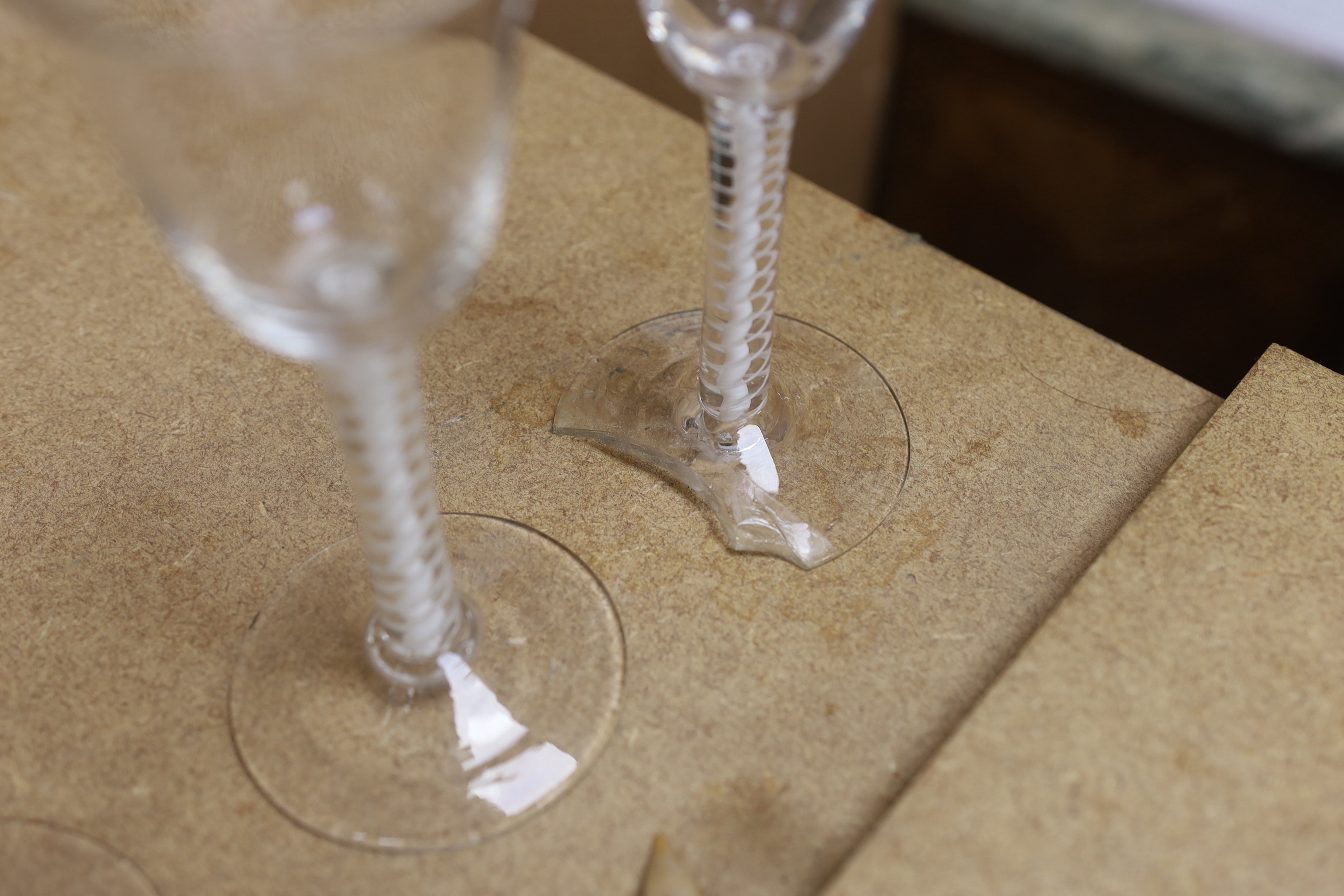 A set of six mid 18th century opaque twist stemmed wine glasses (one a.f.)